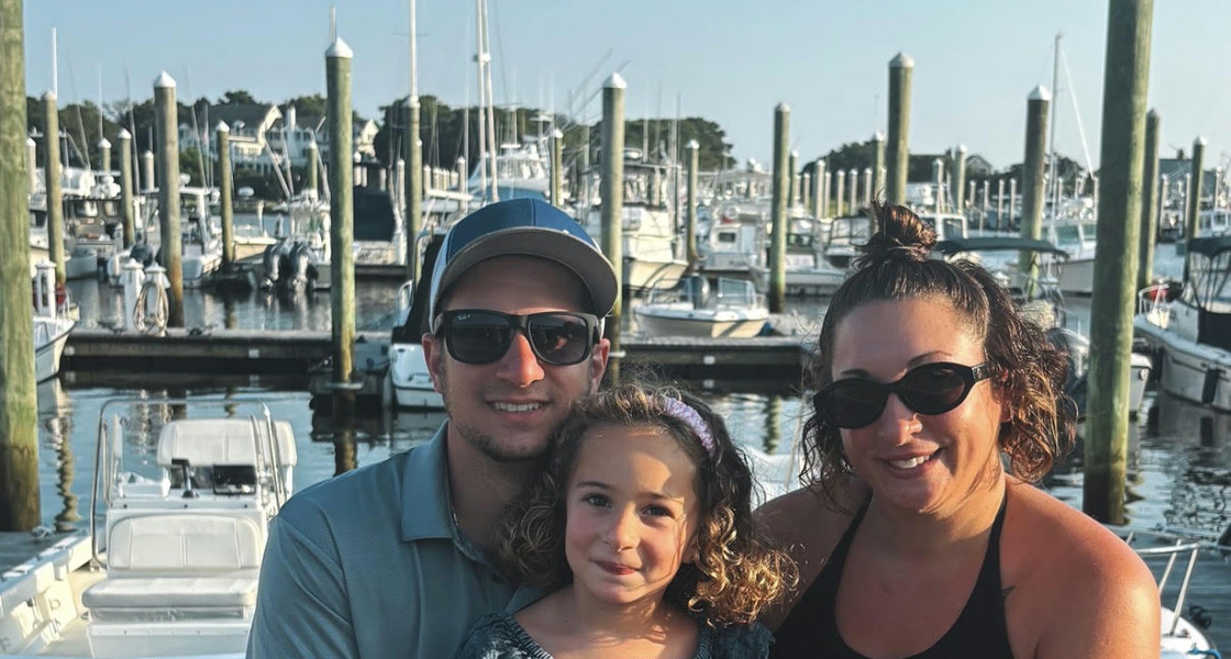 David Melaragno with his family at a marina.