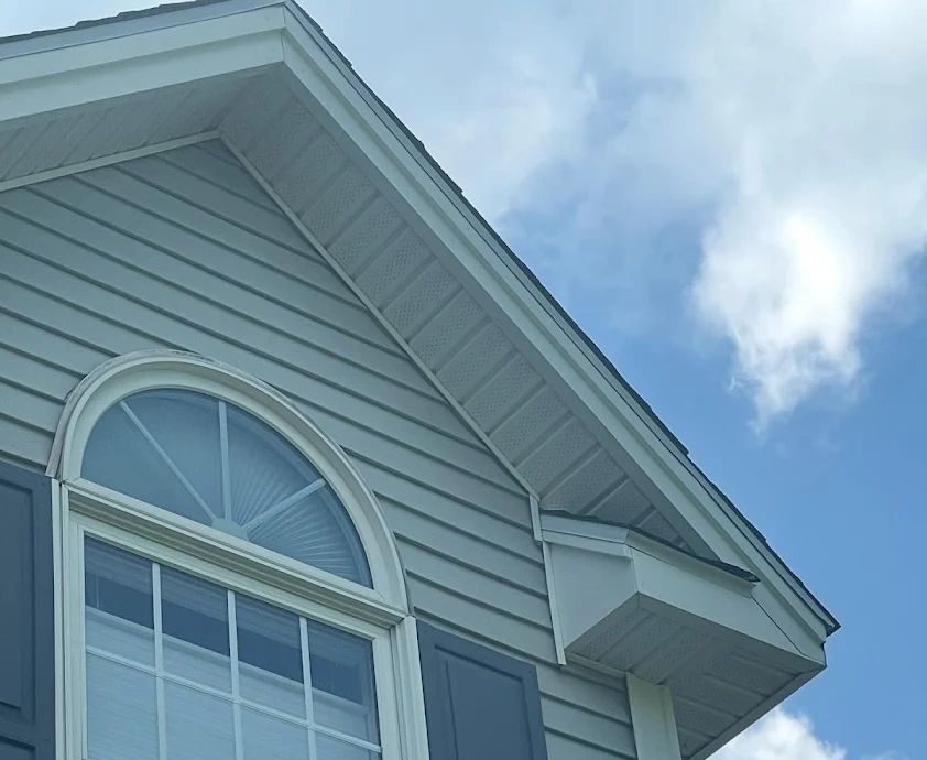 Window, siding, and exterior trim detail on a Connecticut home