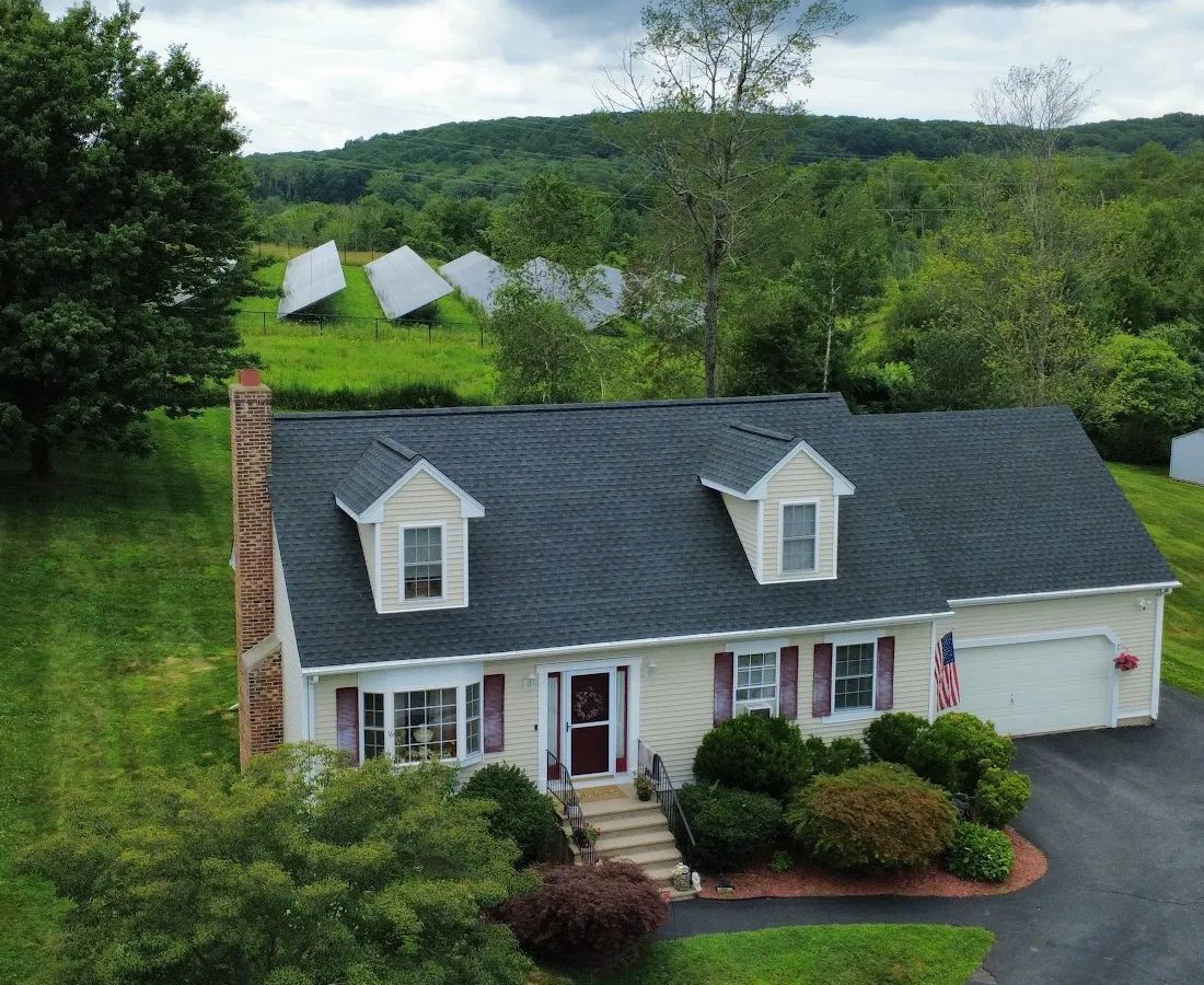 Completed asphalt-shingle roof and full exterior of a Connecticut home